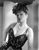 Claire Trevor Posed in Black Corset with Floral Hat Photo Print - Item # VARCEL705198