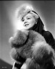 Claire Trevor Looking up in Fur Dress with a Little Smile Photo Print - Item # VARCEL705200