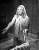 Veronica Carlson standing with arm raised and hand out, clutching a jacket to her chest Photo Print - Item # VARCEL705499