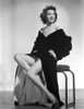 Jane Withers Seated on a Chair in Black V-Neck Ruffled Sleeve Dress with Sheer Petticoat Photo Print - Item # VARCEL705605