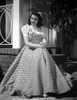 Jane Withers Posed in White Short Sleeve with Ruffled Collar Gingham Dress with Hands Together Photo Print - Item # VARCEL705629