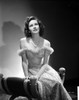 Teresa Wright Seated in Off Shoulder Dress Photo Print - Item # VARCEL705771