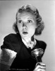 Jane Wyman Portrait in Black Velvet Shirt and Curtain Curl Hair with Hands Holding a Flashlight Photo Print - Item # VARCEL705860