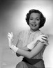 Jane Wyman Portrait in White Short Sleeve Silk Dress and Linen Tweed Skirt with Arms Crossed with Gloves Photo Print - Item # VARCEL705847
