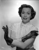 Jane Wyman Portrait in White Silk Lace Short Sleeve Bodice and Black Leather Gloves with Arms Crossed in White Background Photo Print - Item # VARCEL705892