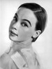 Leslie Caron posed on Side Ways in White Background Photo Print - Item # VARCEL706076