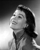 Phyllis Kirk smiling and Looking Up wearing Coat in Gray scale Portrait Photo Print - Item # VARCEL706155