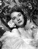 Polly Bergen Posed in a Portrait wearing White Gown with Flower on Ear Photo Print - Item # VARCEL706250