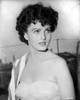 Ursula Theiss wearing a sweetheart bodice with a towel over her shoulder, looking away from the camera Photo Print - Item # VARCEL706379