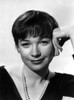 Shirley MacLaine Portrait in Black V-Neck Long Sleeve Shirt and Pearl Necklace with Left Hand on the Head Photo Print - Item # VARCEL706617