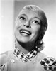 Carol Channing in a Printed Dress Looking Up and smiling Photo Print - Item # VARCEL706706