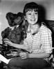 Hayley Mills wearing a Checkered Polo Shirt with Stuffed Toy Photo Print - Item # VARCEL707011