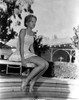 Hayley Mills sitting in Printed Dress Photo Print - Item # VARCEL707019