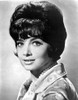 Suzanne Pleshette wearing a Printed Blouse with Pearl Necklace Photo Print - Item # VARCEL707153
