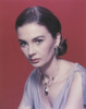 Jean Simmons Close-up Portrait in Grey Linen V-Neck Sleeveless Dress and Necklace with Dangling Earrings in Red Background Photo Print - Item # VARCEL707156