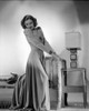 Barbara Stanwyck standing Side View with Legs Raised Photo Print - Item # VARCEL707497