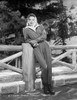Barbara Stanwyck Leaning in Fence Classic Portrait Looking Sideways Photo Print - Item # VARCEL707499