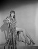 Barbara Stanwyck sitting on Chair in Long Dress Classic Portrait Photo Print - Item # VARCEL707601