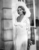 Jeanne Moreau Posed in White V-Neck Sheer Sleeve Lace Silk Dress and Feather Hat Photo Print - Item # VARCEL707670