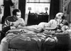 A film still of Sue Lyon lying on a bed Photo Print - Item # VARCEL707730