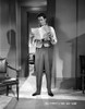 James Stewart standing in White Long Sleeve Shirt and Vest Suit while Reading a Paper Photo Print - Item # VARCEL707960