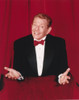 Jerry Stiller Posed in Black Suit and Red Bow Tie in Red Background Photo Print - Item # VARCEL707975