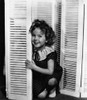 Shirley Temple Leaning on a Blinder in a Classic Portrait Photo Print - Item # VARCEL708452