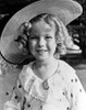 Shirley Temple wearing a White Dress with Matching Hat Photo Print - Item # VARCEL708458