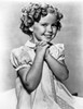 Shirley Temple wearing a Cap-Sleeve House Dress Photo Print - Item # VARCEL708490