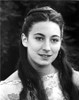 Anjelica Huston Showing a Little Smile wearing a White Dress Portrait in Classic Photo Print