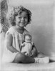 Shirley Temple wearing a House Dress and Holding a Doll in a Classic Portrait Photo Print - Item # VARCEL708544