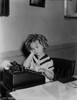 Shirley Temple Typing in White Dress Photo Print - Item # VARCEL708554