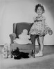 Shirley Temple standing with stuffed animals and a chair Photo Print - Item # VARCEL708586