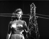 A publicity still of Alison Hayes next to a power pylon Photo Print - Item # VARCEL708814