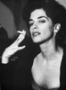 A Portrait Of Annabella Sciorra Smoking A Cigarette Photo Print - Item # VARCEL708892
