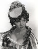 Portrait of Lana Turner posed in Elegant Dress with Floral Cap Photo Print - Item # VARCEL709014