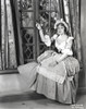 Lana Turner posed Beside the Window in Elegant Dress Photo Print - Item # VARCEL709024