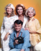 Robert Vaughn Holding a Camera in Yellow Background Photo Print - Item # VARCEL709136