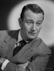 John Wayne wearing Suit and Crossing His Arms Photo Print - Item # VARCEL709246