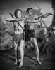 Johnny Weissmuller Leading a Young Man to Shoot His Arrow in a Classic Movie Scene Photo Print - Item # VARCEL709304