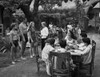 Johnny Weissmuller Talking with an Old Lady in a Movie Scene Photo Print - Item # VARCEL709345