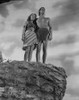 Johnny Weissmuller standing on a Cliff with a Woman in a Movie Scene Photo Print - Item # VARCEL709322