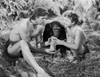 Johnny Weissmuller Holding a Scroll with a Kid in a Classic Movie Scene Photo Print - Item # VARCEL709362