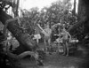 Johnny Weissmuller Helping a Woman to Get Down the Tree in a Movie Scene Photo Print - Item # VARCEL709364