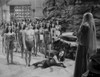 Johnny Weissmuller standing in Front of the Leader of the Amazons in a Movie Scene Photo Print - Item # VARCEL709375