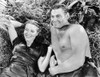 Johnny Weissmuller Lying on the Ground with a Woman in a Classic Movie Scene Photo Print - Item # VARCEL709381