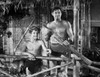 Johnny Weissmuller Holding a Weapon in a Classic Movie Scene Photo Print - Item # VARCEL709388