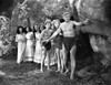 Johnny Weissmuller Guiding a Group of Woman in a Movie Scene Photo Print - Item # VARCEL709366
