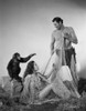 Johnny Weissmuller Releasing a Woman from a Fish Net in a Classic Movie Scene Photo Print - Item # VARCEL709401