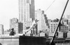 Johnny Weissmuller Riding a Rope Swing in a Classic Movie Scene Photo Print - Item # VARCEL709438